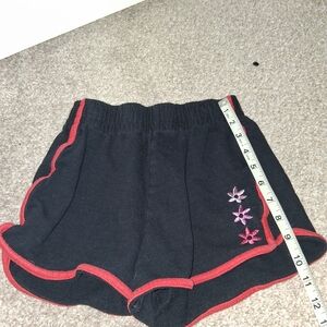 Black Shorts with Red Trim and Floral Embroidery